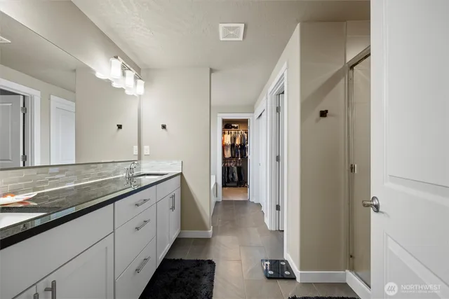 a bathroom with bathtub and window
