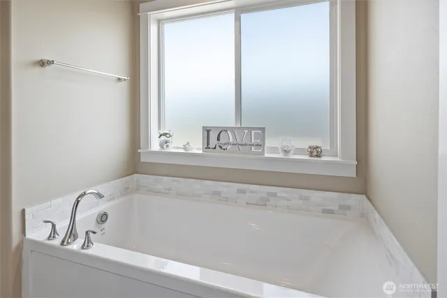 a view of a room with chairs and a flat screen tv