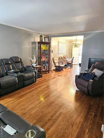 a living room with furniture and large windows