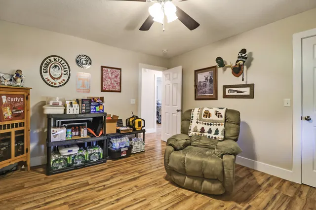 a living room with couch and a bookshelf