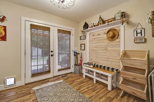 a view of an entryway with wooden floor