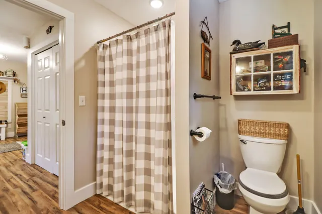 a white toilet sitting next to a bathroom sink