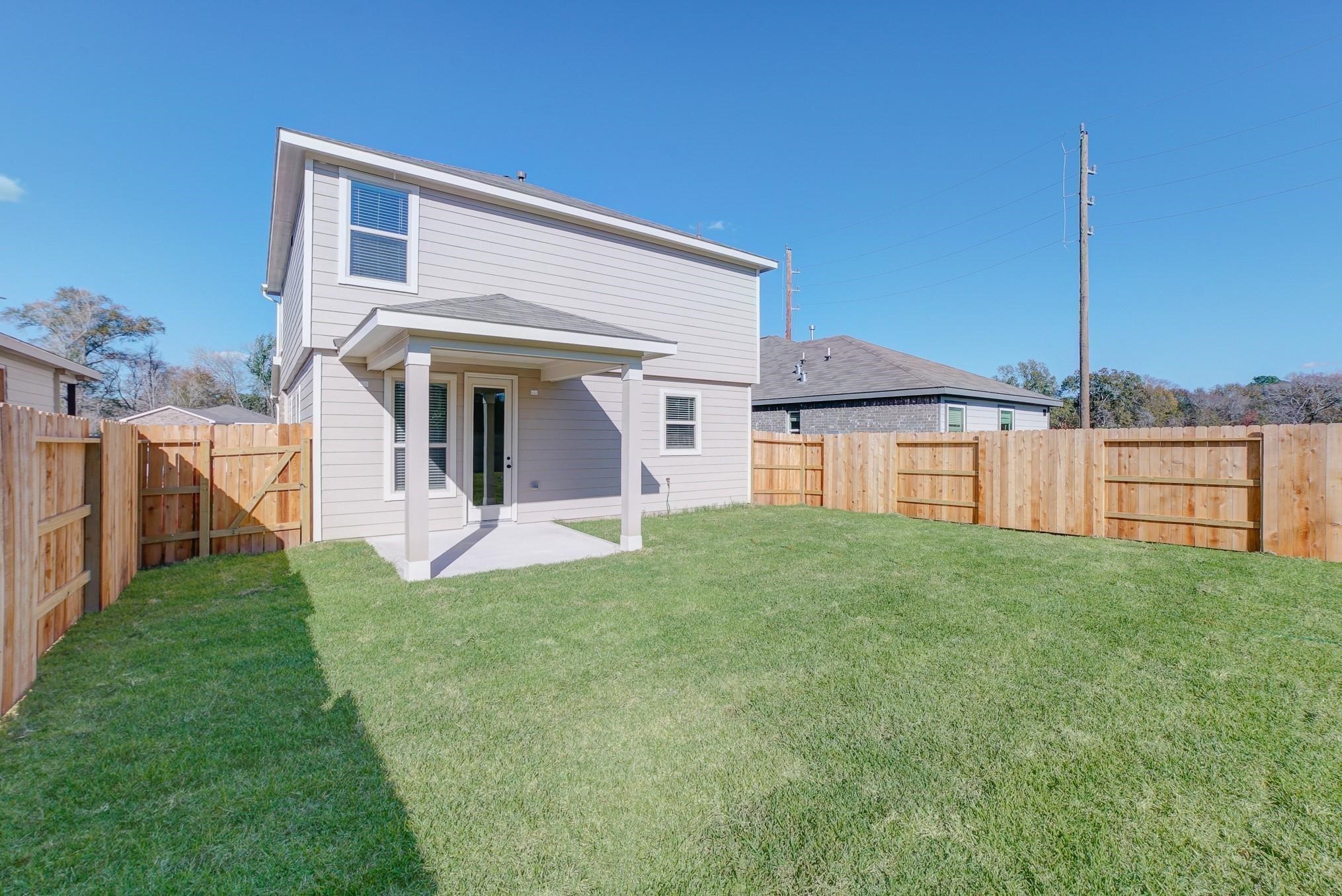 9307 Central Place Magnolia, TX 77354 - Photo 17 of 21 a view of an house with backyard porch and entertaining space