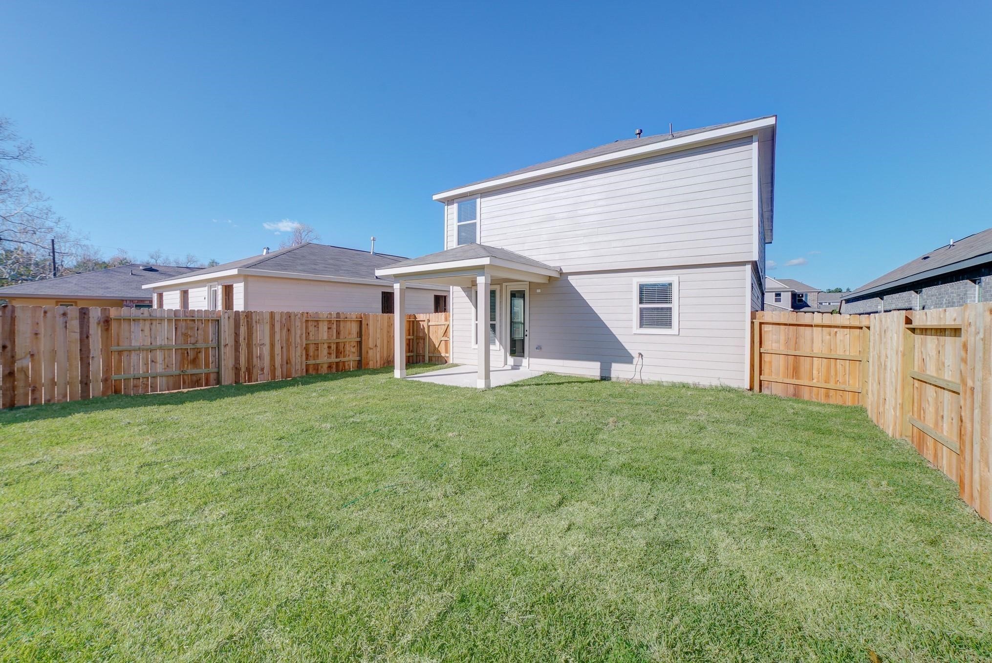 9307 Central Place Magnolia, TX 77354 - Photo 18 of 21 a view of a house with backyard and garden