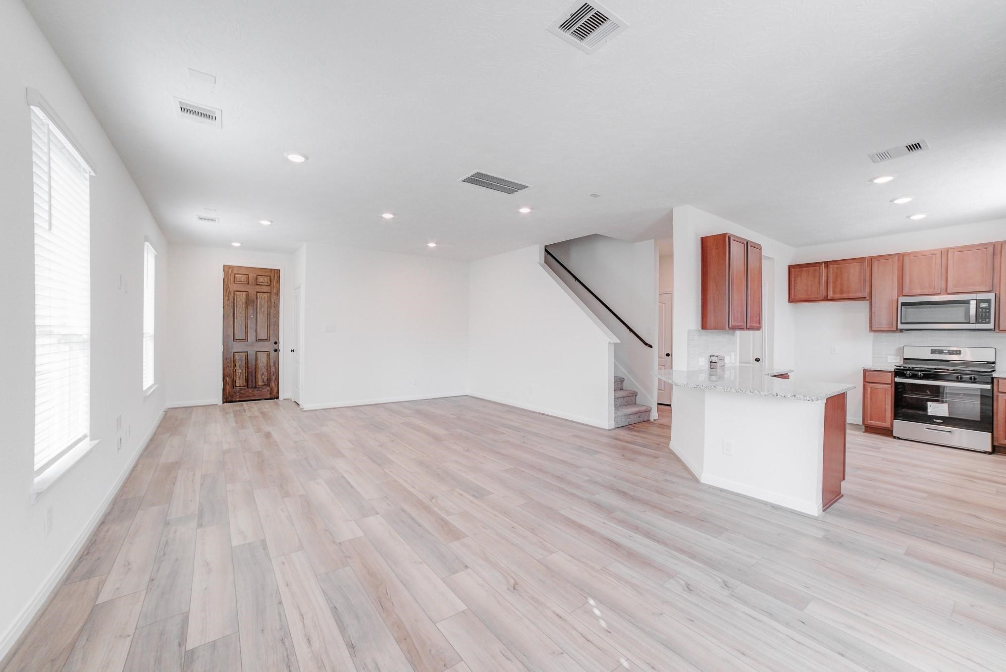 9307 Central Place Magnolia, TX 77354 - Photo 21 of 21 a view of a kitchen with furniture and wooden floor