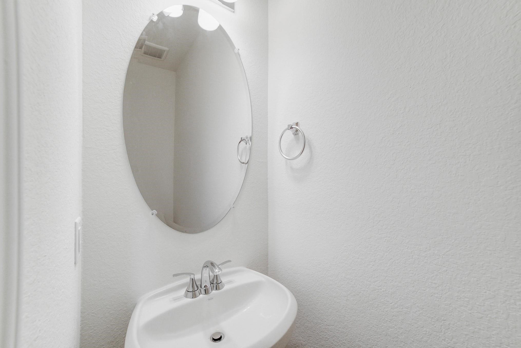 9307 Central Place Magnolia, TX 77354 - Photo 4 of 21 a bathroom with a sink and mirror