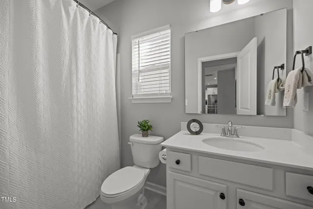 an entryway space with wooden floor and stairs