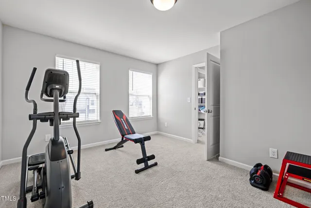 a room with furniture and gym equipment
