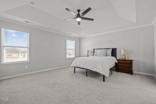 a bathroom with double vanity sink a toilet and a mirror