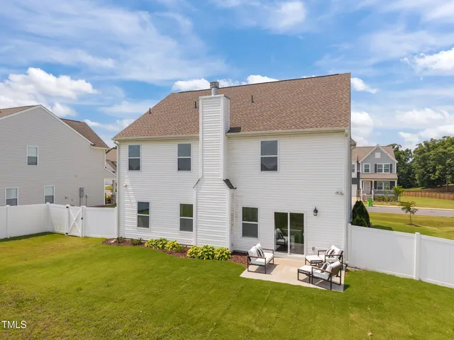 a view of a patio with chairs and a table
