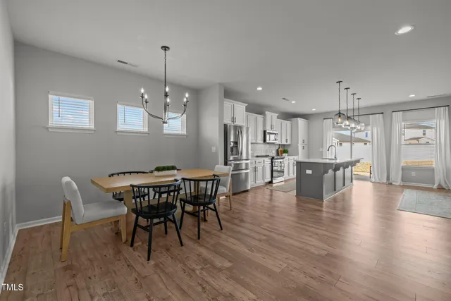 a view of a livingroom with workspace and a window