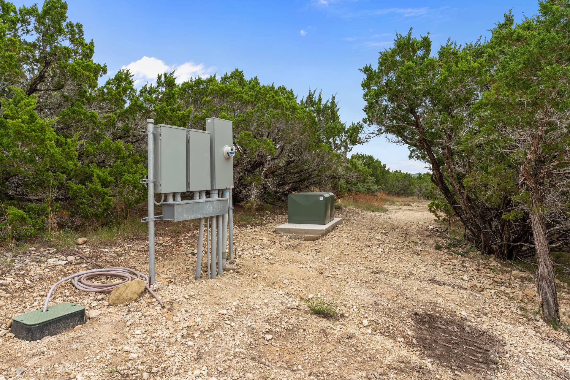 182 Quail Creek Road Marble Falls, TX 78654 - Photo 7 of 20 Electric panels for underground electric lines from top to the bottom of the property
