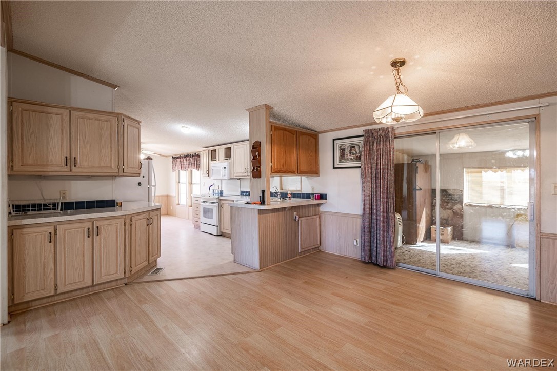 822 South Houck Road Golden Valley, AZ 86413 - Photo 8 of 47 a kitchen with a refrigerator sink and cabinets