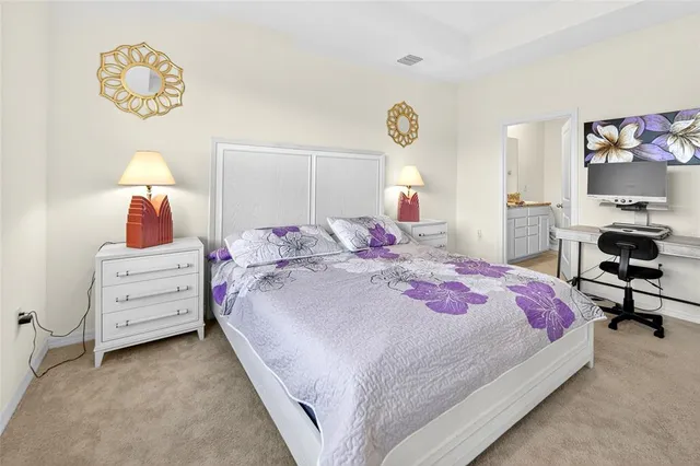 a bedroom with a bed and a table in it