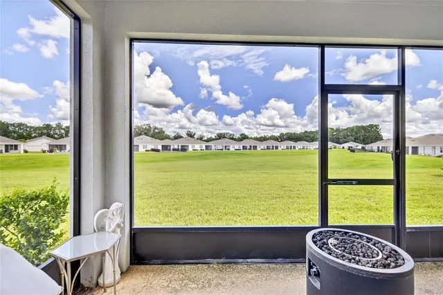 a view of a door and a window