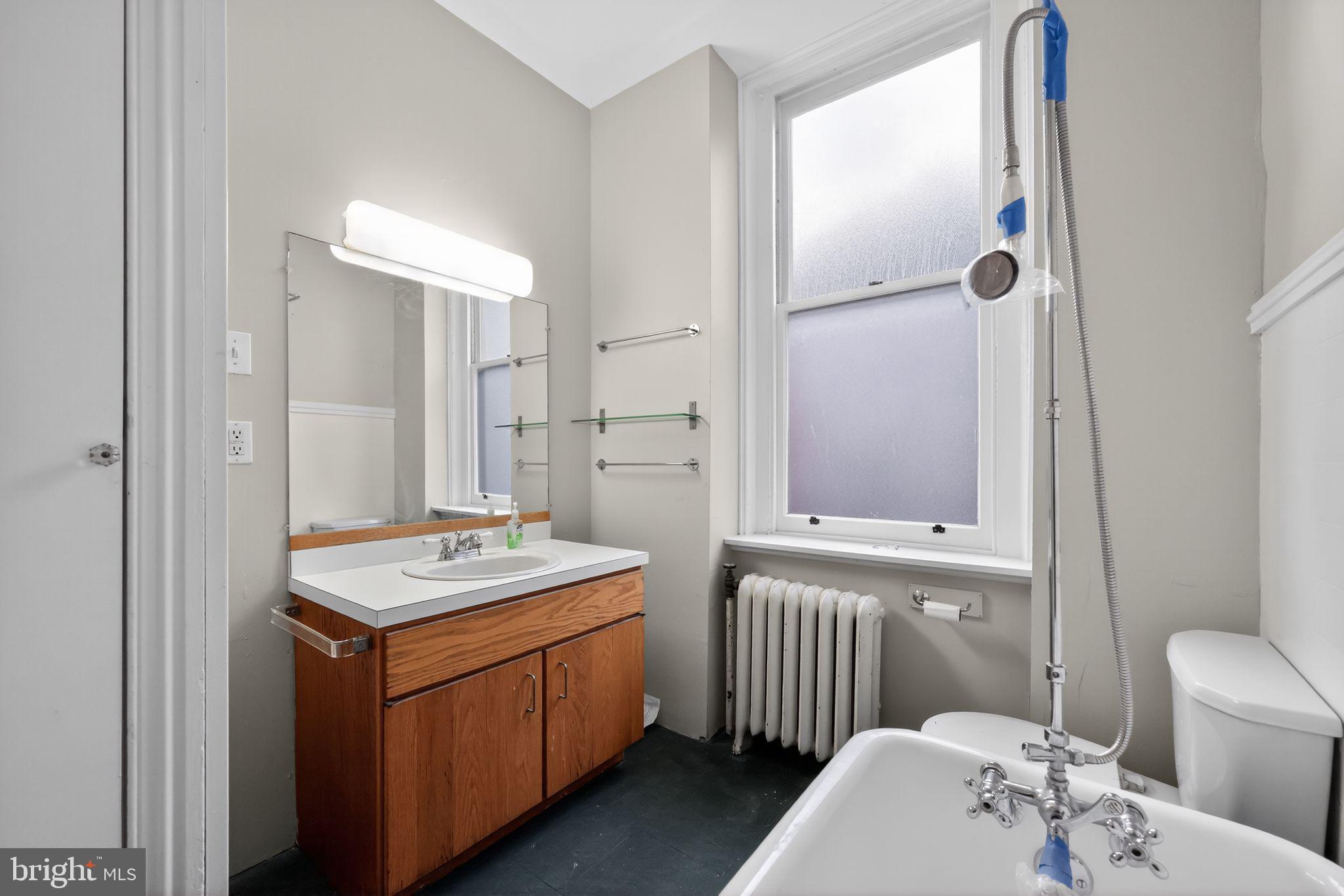 2117 Spruce Street, Unit 3 Philadelphia, PA 19103 - Photo 13 of 14 a bathroom with a sink a toilet and shower
