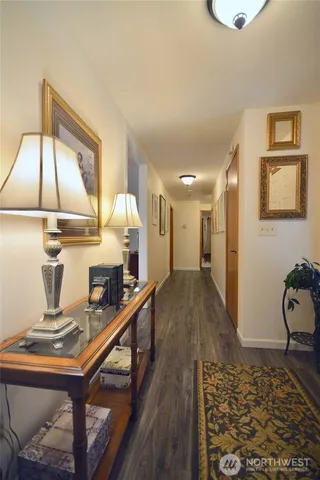 a bathroom with a granite countertop sink toilet and a mirror
