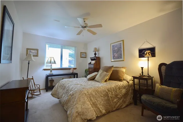 a view of a patio with a dining table and chairs with wooden floor