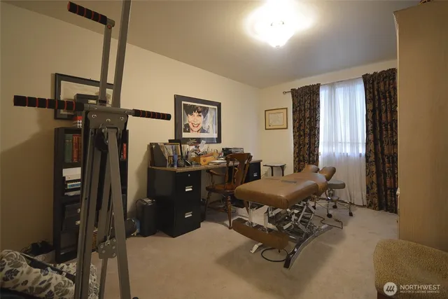 a view of a chair and tables front of the house