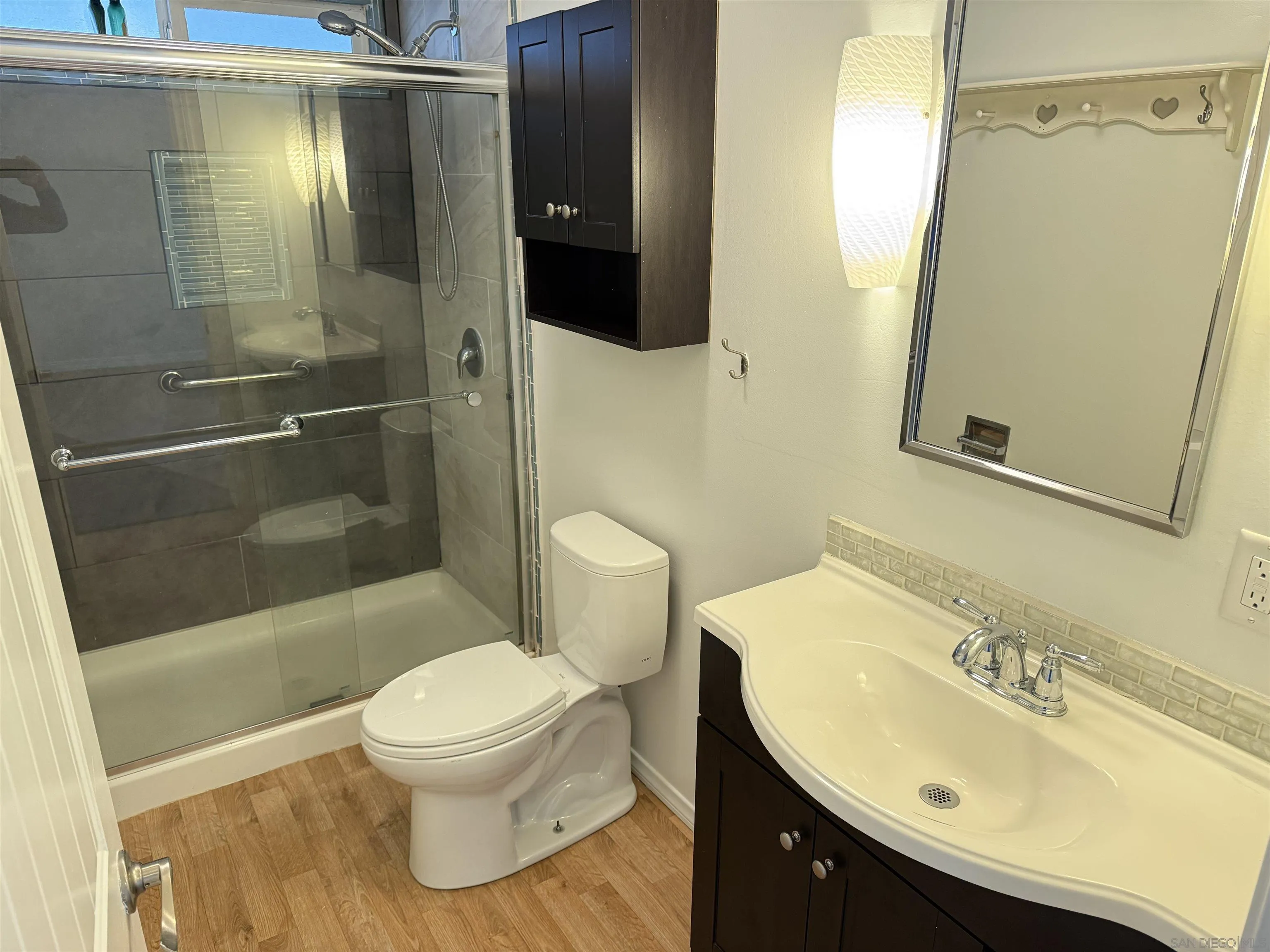 7467 Mission Gorge Road, Unit SPC 19 Santee, CA 92071 - Photo 13 of 20 a bathroom with a sink toilet and shower