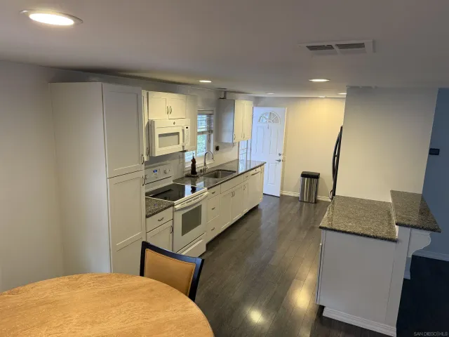 a room with a bed and furniture