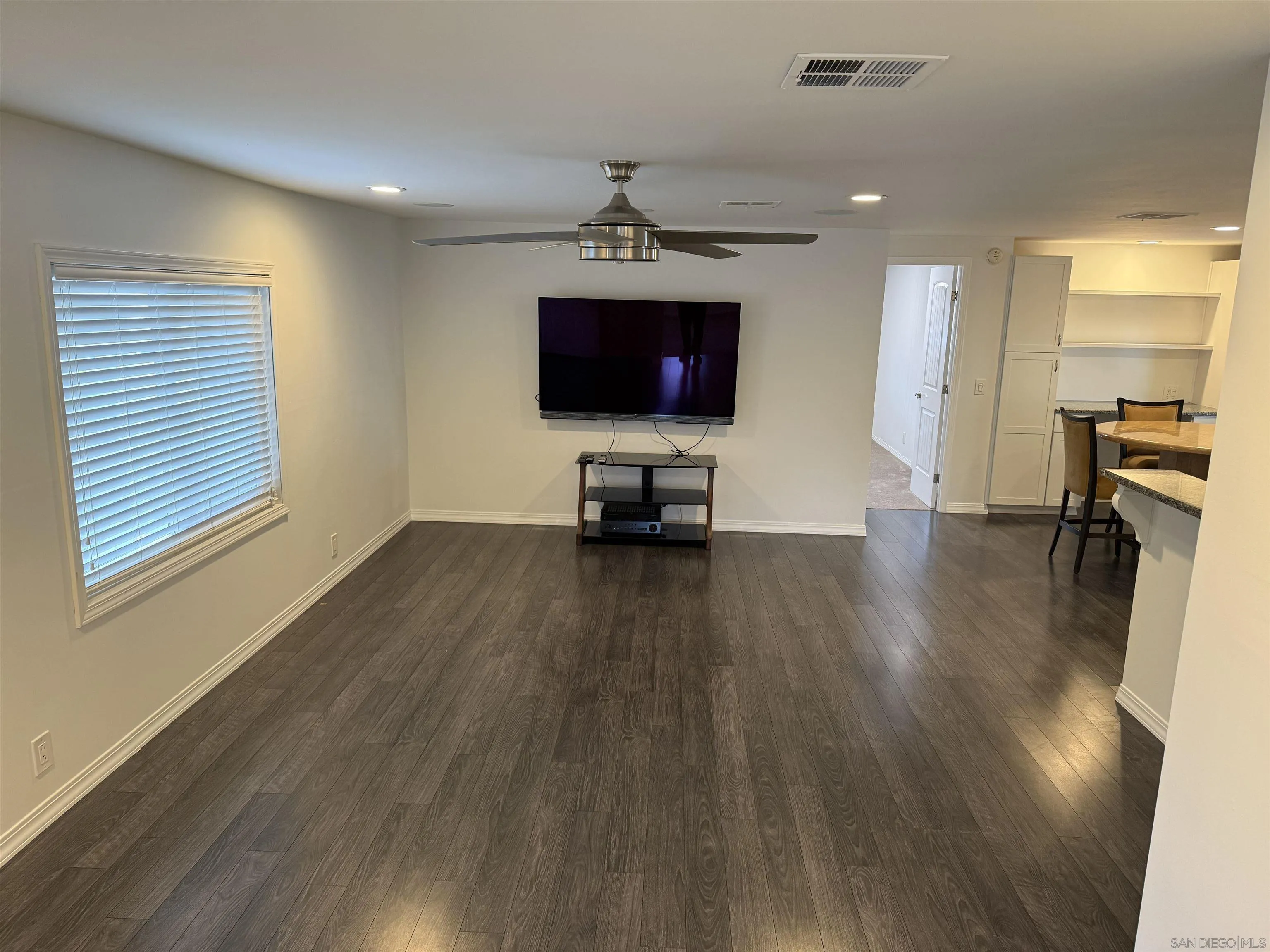 7467 Mission Gorge Road, Unit SPC 19 Santee, CA 92071 - Photo 7 of 20 a living room with furniture and a flat screen tv