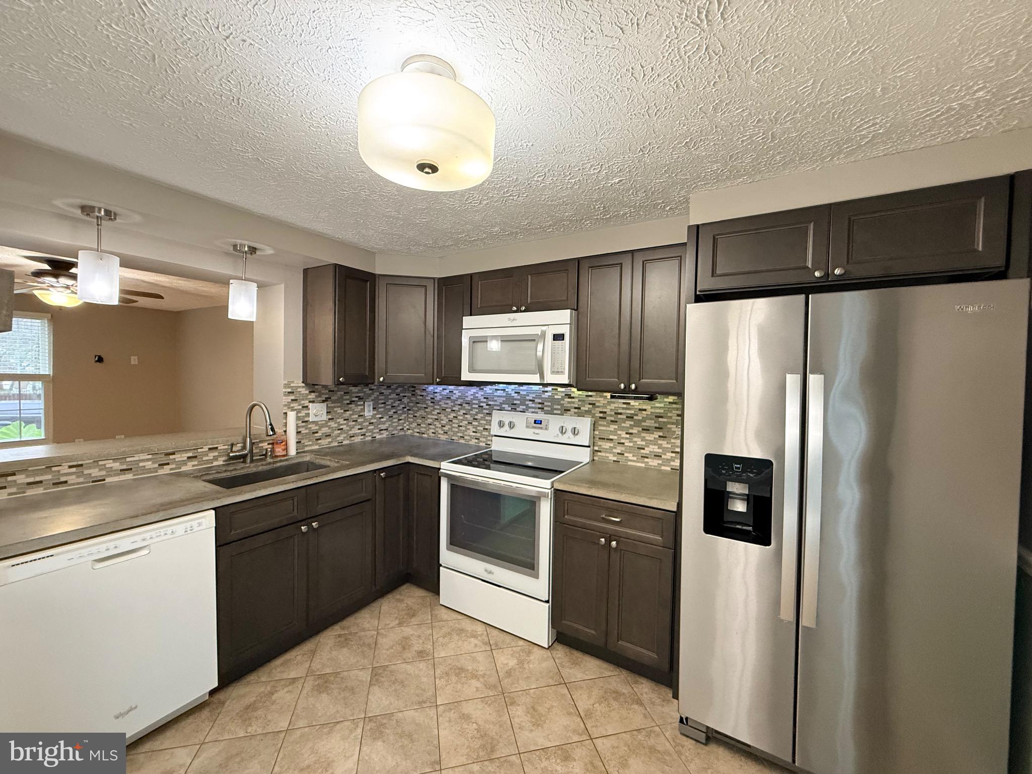 3750 Timahoe Circle Baltimore, MD 21236 - Photo 5 of 29 a kitchen with stainless steel appliances granite countertop a refrigerator and a sink