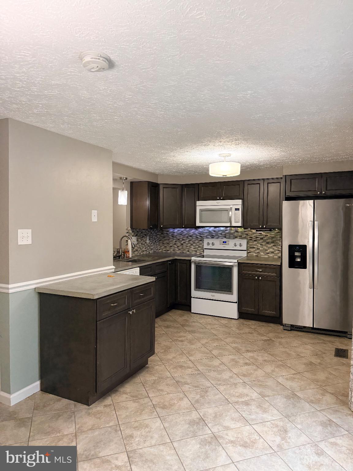 3750 Timahoe Circle Baltimore, MD 21236 - Photo 7 of 29 a kitchen with stainless steel appliances granite countertop a stove a sink and a refrigerator