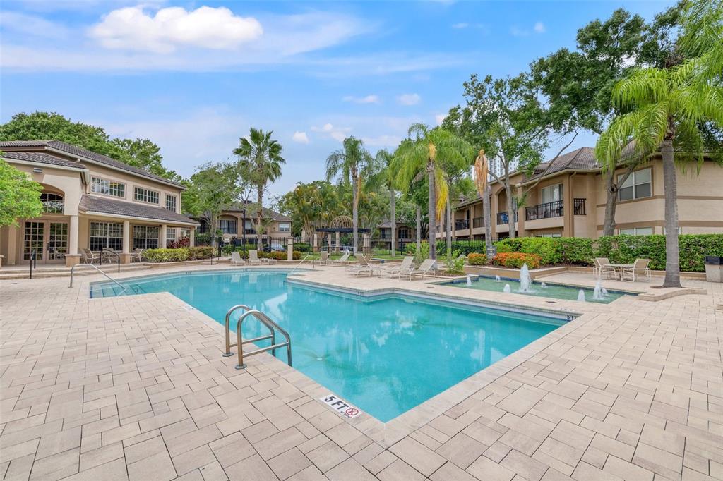 1039 Normandy Trace Road, Unit 1039 Tampa, FL 33602 - Photo 19 of 19 a view of swimming pool and outdoor seating