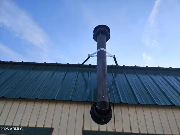 a view of a chandelier fan and wooden floor