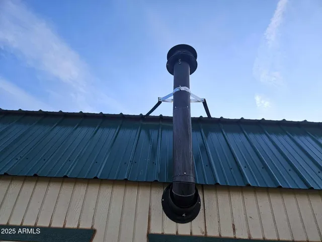 a view of a chandelier fan and wooden floor