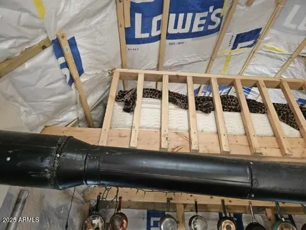 a kitchen with a refrigerator and cabinets