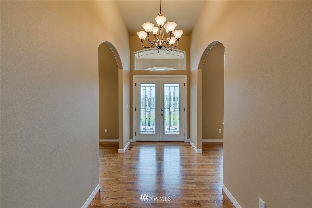 89 Springhill Drive East Wenatchee, WA 98802 - Photo 17 of 36 a view of a room with wooden floor and chandelier