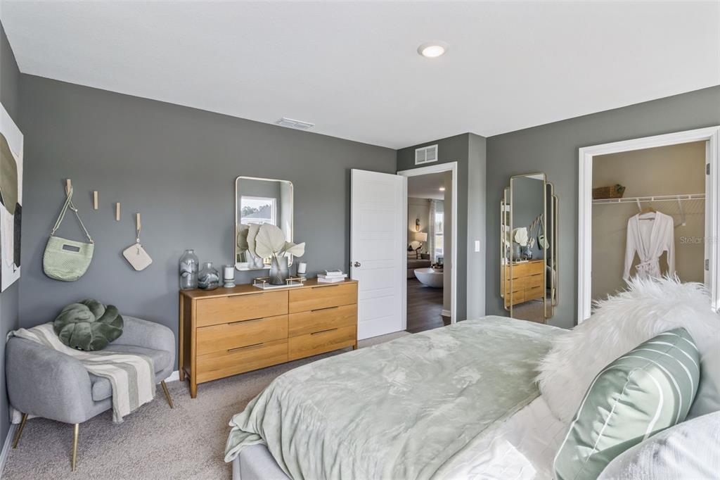 3433 Nettle Loop Tavares, FL 32778 - Photo 21 of 31 a bedroom with a bed and window