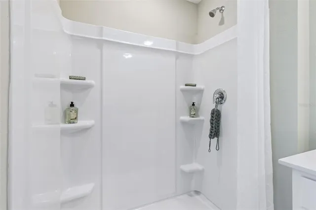 a bathroom with a shower and toilet