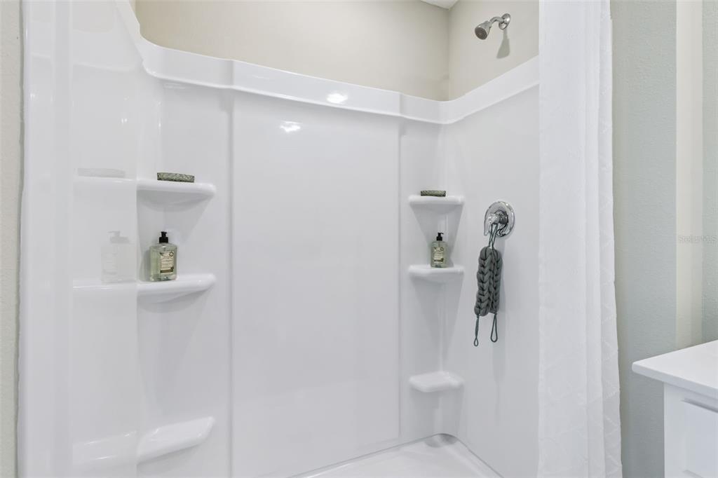 3433 Nettle Loop Tavares, FL 32778 - Photo 23 of 31 a bathroom with a shower and toilet