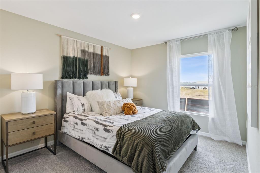 3433 Nettle Loop Tavares, FL 32778 - Photo 31 of 31 a bedroom with a bed and a window