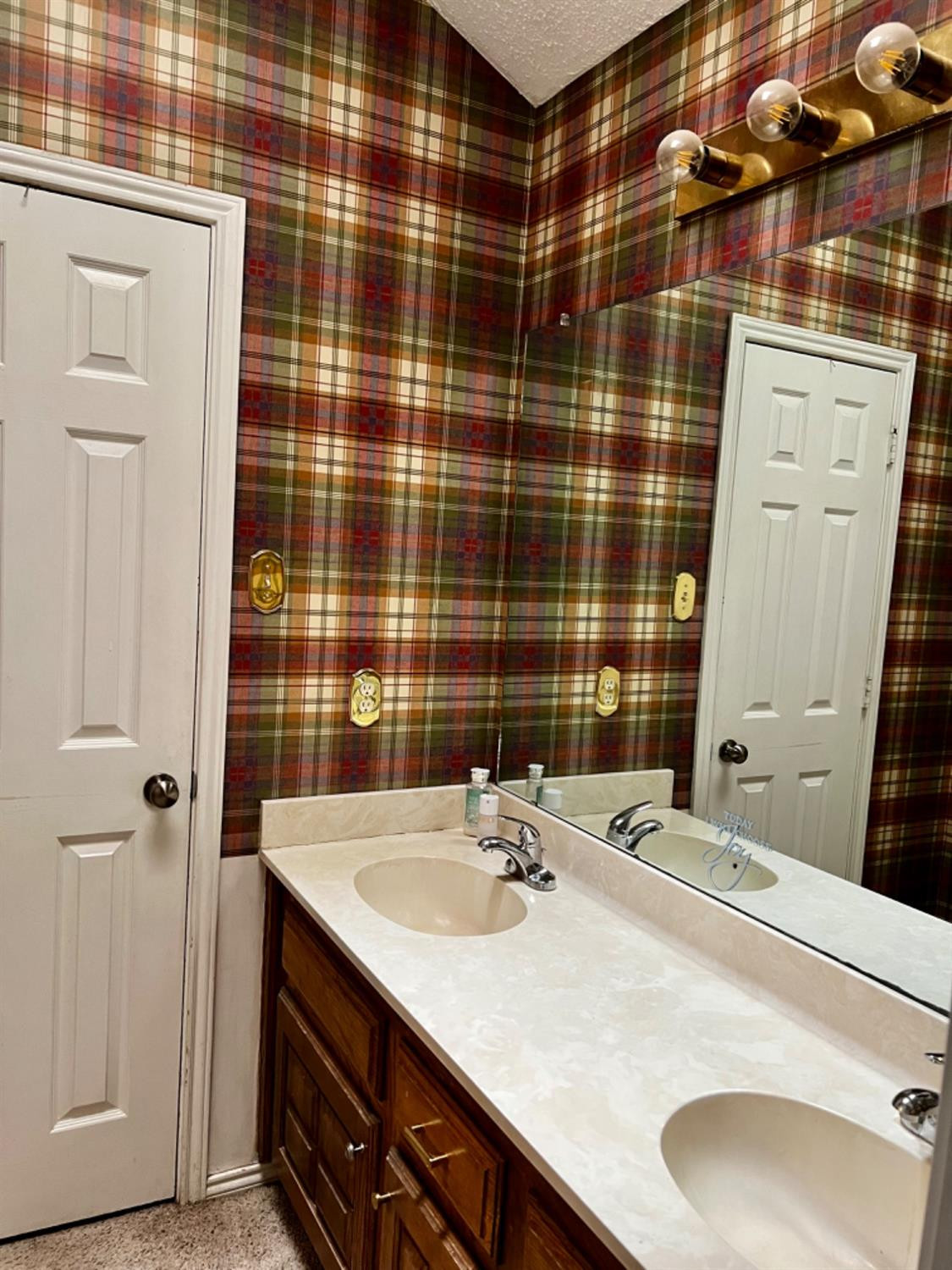 5724 92nd Street Lubbock, TX 79424 - Photo 11 of 18 a bathroom with a sink and a mirror