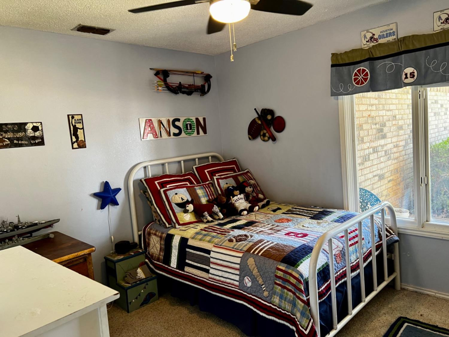 5724 92nd Street Lubbock, TX 79424 - Photo 15 of 18 a bedroom with a bed and a window