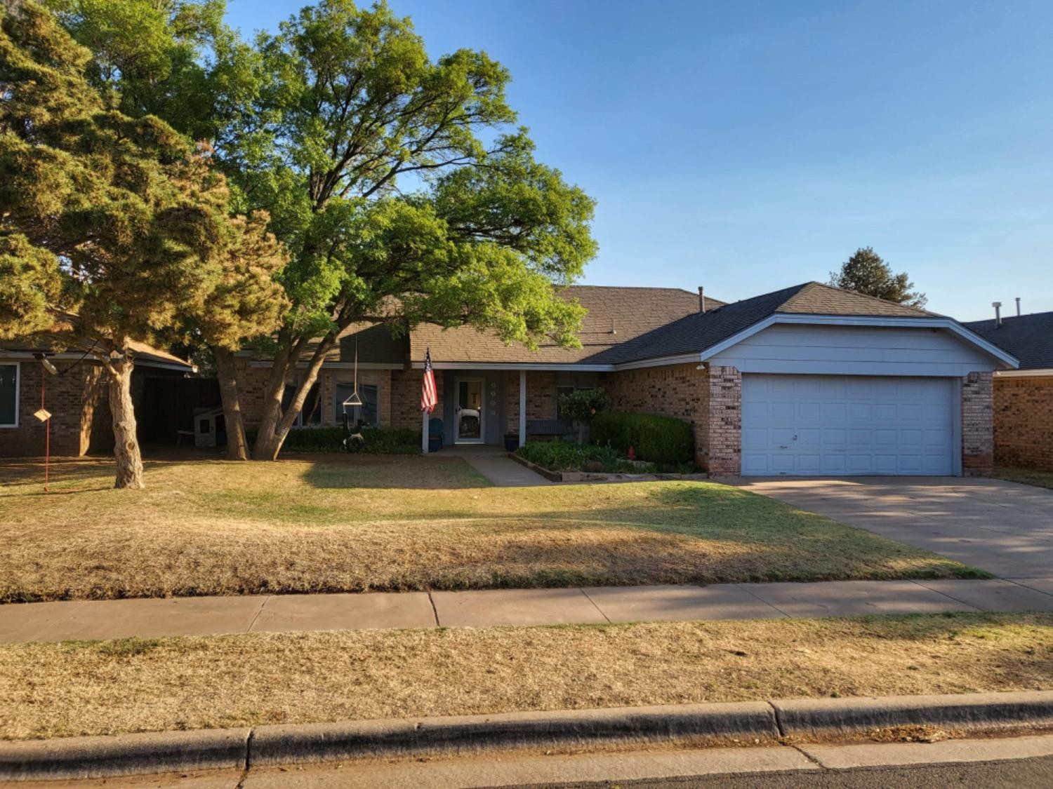 5724 92nd Street Lubbock, TX 79424 - Photo 18 of 18 a front view of a house with garden