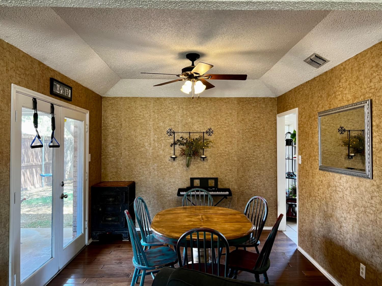 5724 92nd Street Lubbock, TX 79424 - Photo 4 of 18 a dining room with furniture and chandelier fan