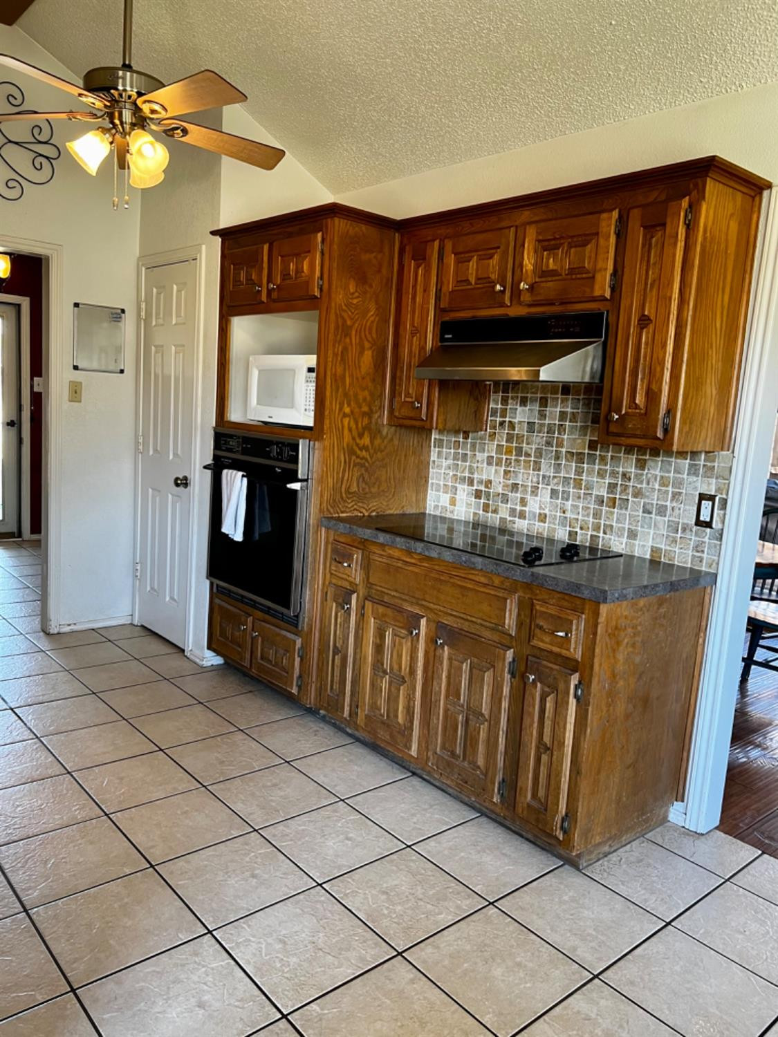 5724 92nd Street Lubbock, TX 79424 - Photo 6 of 18 a kitchen with stainless steel appliances granite countertop a refrigerator and a sink