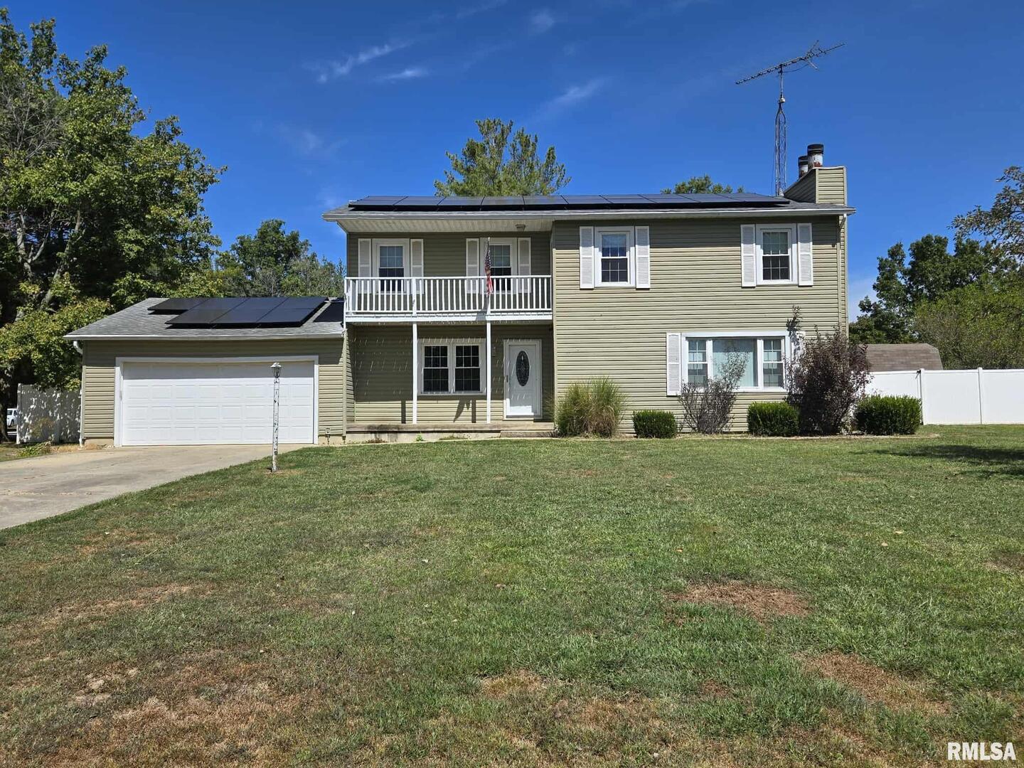 108 Mockingbird Lane Woodlawn, IL 62898 - Photo 18 of 59 a front view of a house with a garden