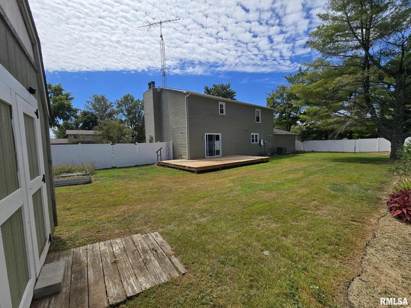 108 Mockingbird Lane Woodlawn, IL 62898 - Photo 19 of 59 a view of a backyard with a garden