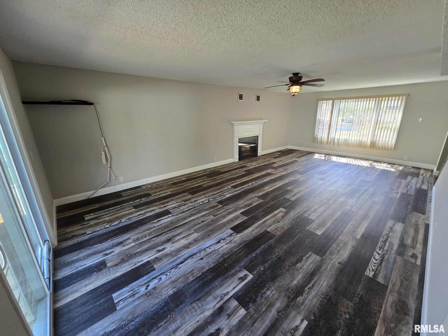 108 Mockingbird Lane Woodlawn, IL 62898 - Photo 25 of 59 a view of room with window and wooden floor