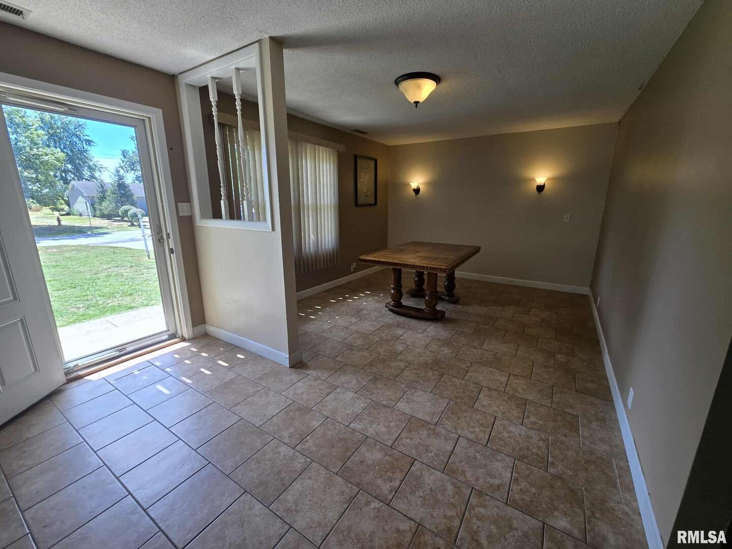 108 Mockingbird Lane Woodlawn, IL 62898 - Photo 32 of 59 a view of a livingroom with a patio and a yard