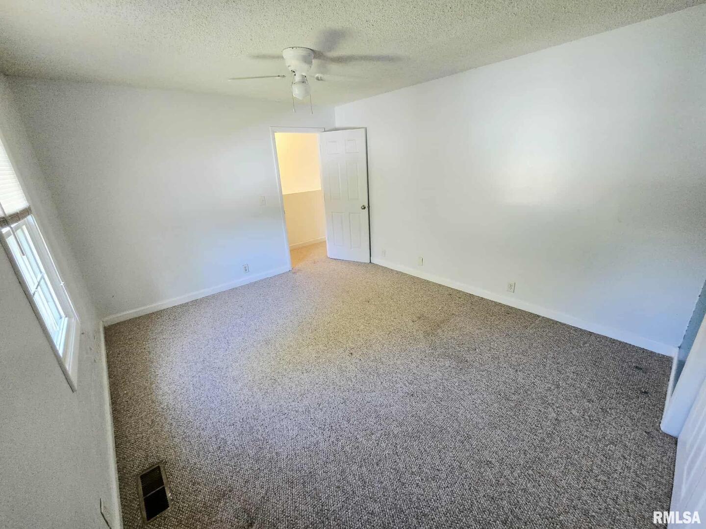 108 Mockingbird Lane Woodlawn, IL 62898 - Photo 55 of 59 an empty room with a empty space and windows