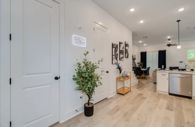 a kitchen with stainless steel appliances a refrigerator sink and microwave
