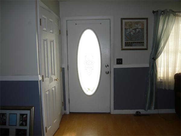 23 Ambrose Street Springfield, MA 01109 - Photo 4 of 15 an view of a door with wooden floor and a window