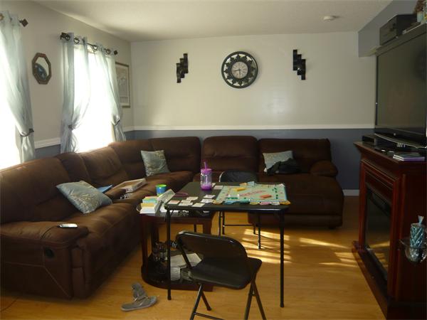 23 Ambrose Street Springfield, MA 01109 - Photo 5 of 15 a living room with furniture and a flat screen tv